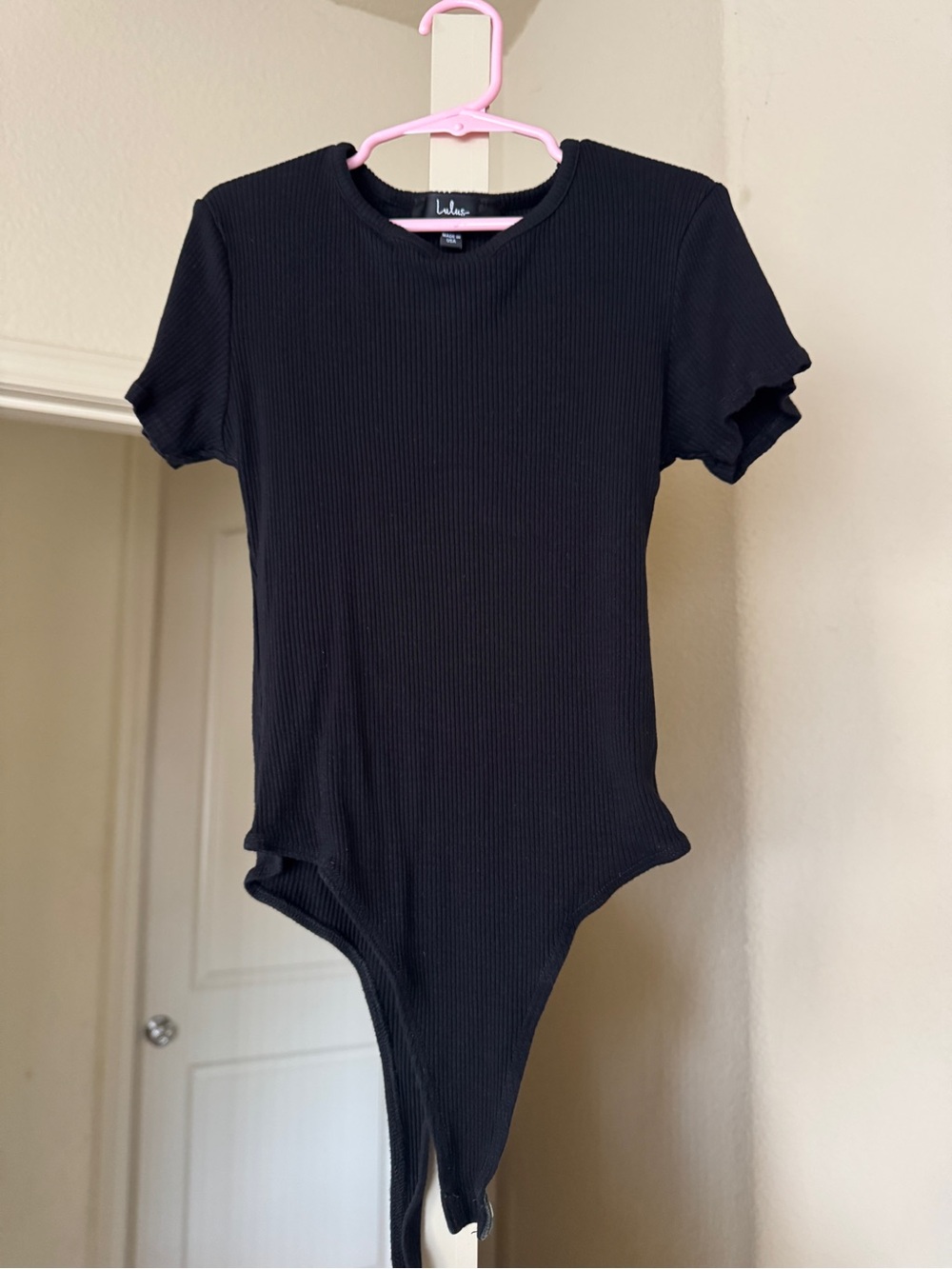 Lulu’s Black Ribbed One-Piece Bodysuit